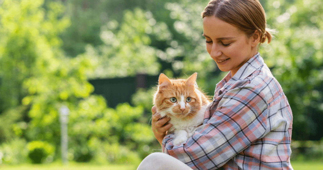 woman holding cat