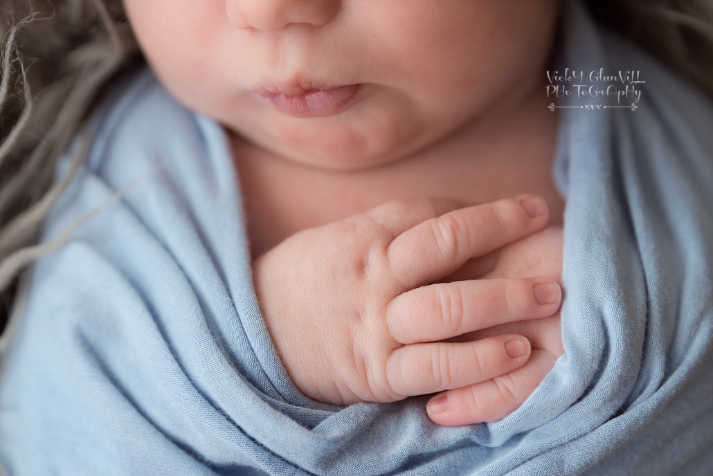 baby wrapped hands